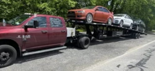 RAM 3500 con trailer de 3 carros cargado